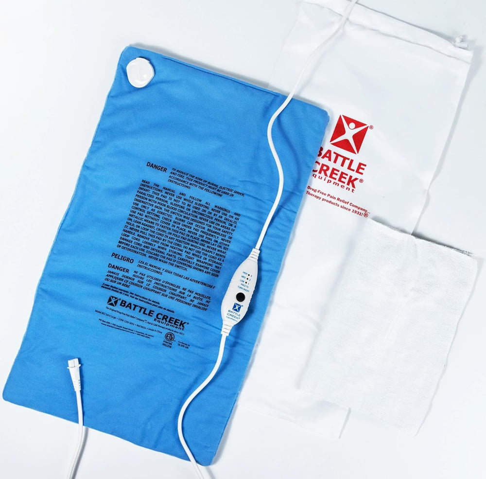 Thermophore Welcome Relief Heat Therapy Pad laid out with wash cloth and carrying bag