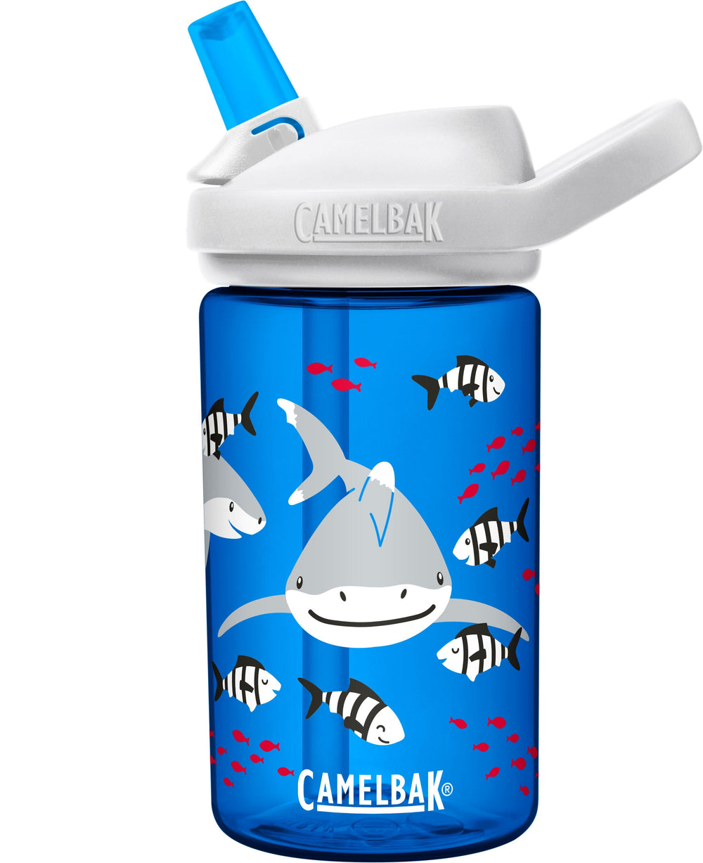blue bottle with smiling sharks swimming with black and white stripped fish  camelbak logo in white letters with blue bite valve and white lid 
